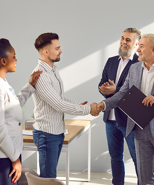Client finalizing business plan and shaking hands with company CEO
